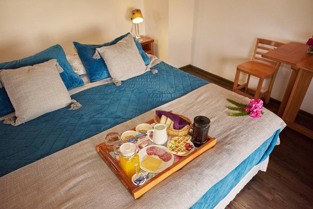Habitación doble deluxe con desayuno en la cama